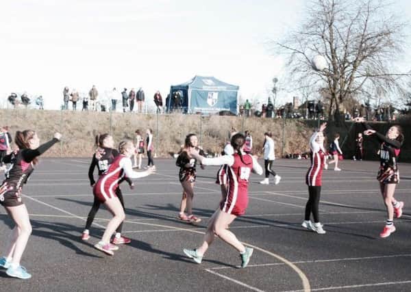 Carre's netballers (in black) in action during their victory over Ecclesbourne School EMN-170902-163650002