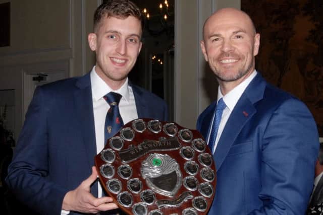 Sleaford CC captain Shaun Morris (left) receives the Winkworth Cup from ex-England international Paul Nixon. EMN-170214-094905002