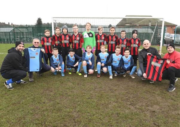 Boston JFC U11's team with new kit, players pictured with L-R Dean Stevens - manager, Andy Willis - sponsor (Clean143), Dale Sharman - sponsor (d signs), David Willis - manager.