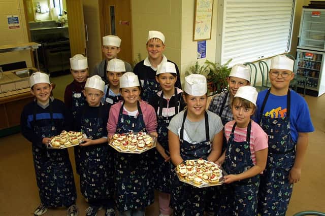 Cookery club members with their scones in July 2004.
