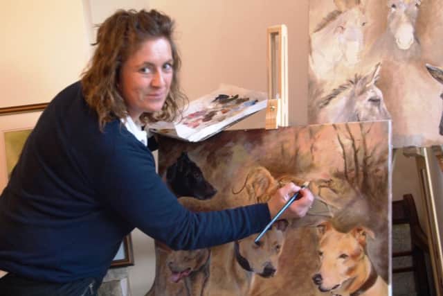 Angela Watson pictured working on one of her newest pieces of artwork at home.