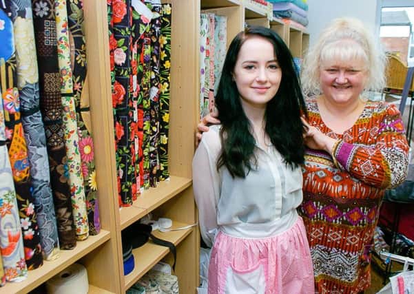 Amber Snary is wearing an apron similar to the one sent to Helen Flanagan by Diane Wainwright (right). EMN-170227-092642001