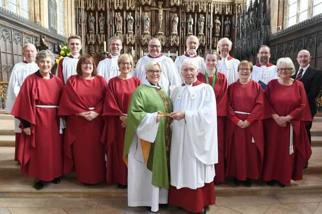Peter Fox with plaque he was presented with at Bosaton Stump, for singing with the church choir for 80 years. Pictured with Revd Alyson Buxton who presented the plaque to him, and members of the choir.