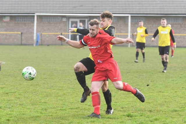 Goalscorer Jamie Elston chases Coningsby's Scott Trestrail.