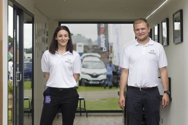 Competition winners Sophie Bulgin and Aaron Walker with a Mantle shipping container. EMN-170228-093633001