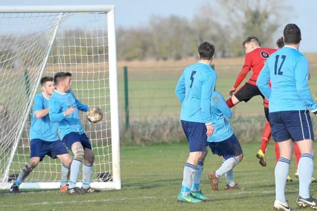 Liam Tunstall back-heels home the winner for Sleaford Sports Amateurs against Nettleham EMN-170221-092249002