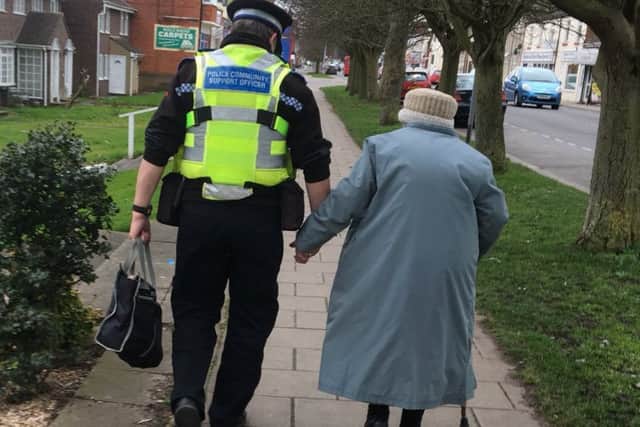 The image of PCSO Dave Bunker helping an elderly lady that warmed the hearts of people on Twiiter across the country. ANL-170221-100506001