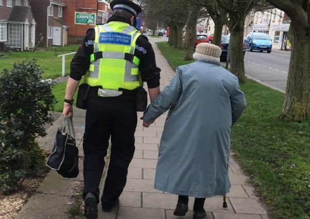 The image of PCSO Dave Bunker helping an elderly lady that warmed the hearts of people on Twiiter across the country. ANL-170221-100506001