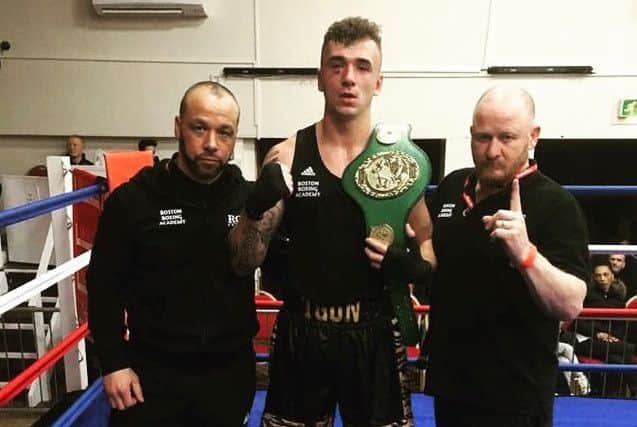 Thomas Pogson with coaches Marv Wiltshire and Steve Davison.