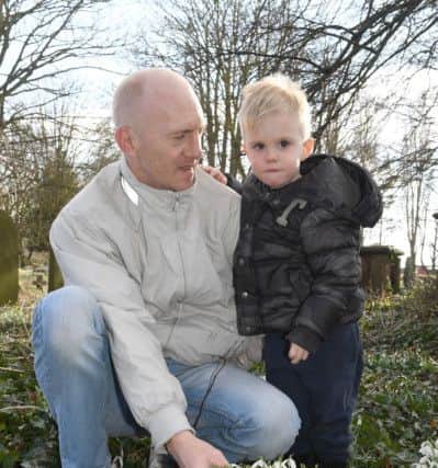 Skirbeck Snowdrop Sunday at Skirbeck St Nicholas' Church. Sonny Spicer of Boston with his son Vinnie Spicer 3.