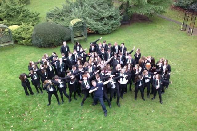 All together, now!: All of Year 11 at Caistor Yarborough Academy with Postively Mad presenter Jae EMN-170603-133921001