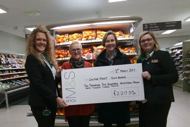 A cheque presentation at M&S in Boston last Wednesday. EMN-170203-110850001