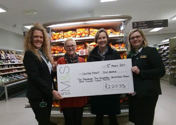 A cheque presentation at M&S in Boston last Wednesday. EMN-170203-110850001