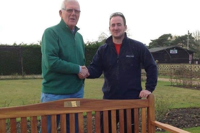 Bernie Buck, left, Charity Steward of the Sir Joseph Banks Daylight Lodge officially handed over the teak bench to Joe Stanhope the Jubilee Park manager. EMN-170226-171232001