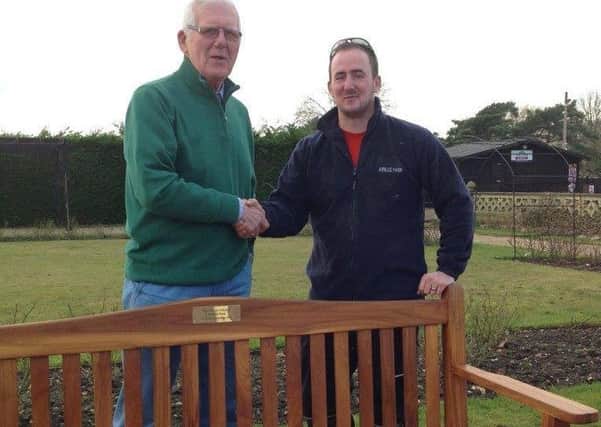 Bernie Buck, left, Charity Steward of the Sir Joseph Banks Daylight Lodge officially handed over the teak bench to Joe Stanhope the Jubilee Park manager. EMN-170226-171232001