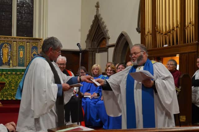 Quin Hiugh made a presentation to outgoing Rural Dean, Canon Ian Robinson EMN-170228-102258001