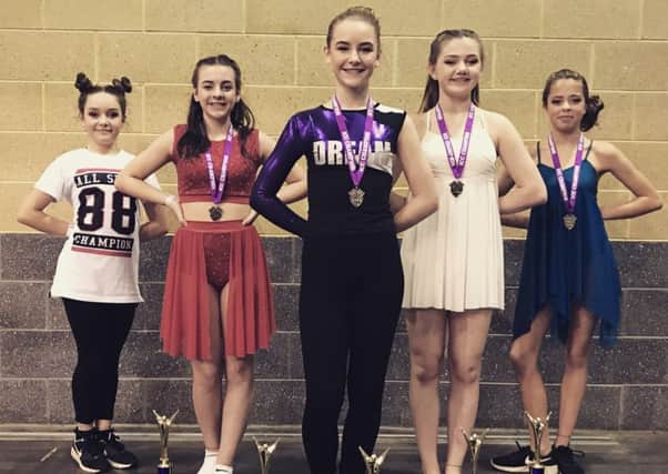 The winning dancers from Dance For Dreams are, from left - Felicity Machin (hip hop 1st place), Erin Morgan (jazz solo second place), Caitlin Hawkins (pom solo first place), Molly Ashcroft (jazz solo first place) and Emily Pearce (lyrics contemporary first place). EMN-170228-113244001