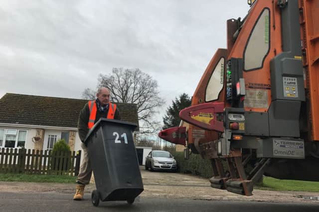 On the bins for hospice charity - NKDC chairman Coun John Money. Photo: NKDC EMN-170103-180137001