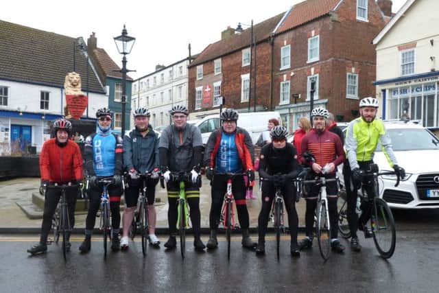 The cyclists in Caistor Market Place at the end of the ride, with Alastair Good third left EMN-170803-114817001