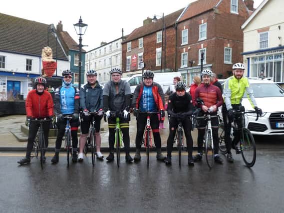 The cyclists in Caistor Market Place at the end of the ride, with Alastair Good third left EMN-170803-114817001