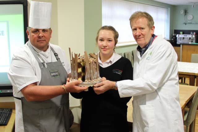 Ash with her winning cake, along with Steve Cottrell, Boston College Programme Area Manager for Catering and Hospitality and Mike Myers, from Myers Bakery.