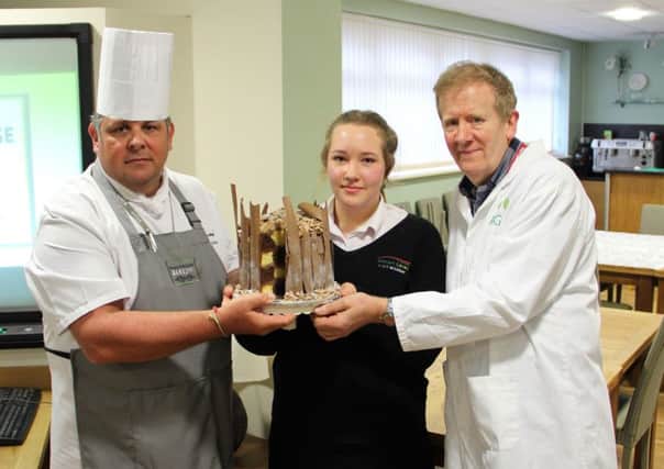 Ash with her winning cake, along with Steve Cottrell, Boston College Programme Area Manager for Catering and Hospitality and Mike Myers, from Myers Bakery.