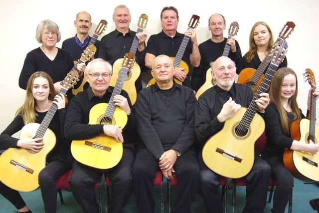 Members of The Solo Classical Guitar Ensemble of South Lincolnshire. EMN-170803-105834001