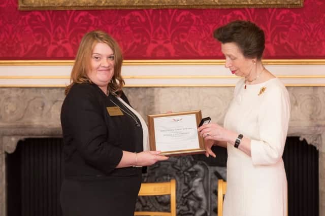 Annette Duckham is given her award by Princess Anne