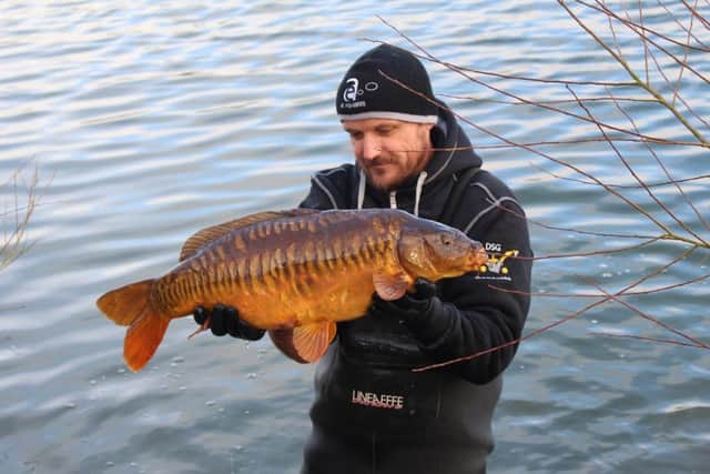 Carp delivery helps put Revesby reservoir on national fishing stage.