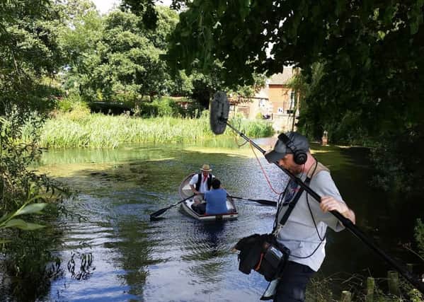 John Bangay filming in the borrowed rowing boat at Cogglesford Mill last year. EMN-170603-150254001