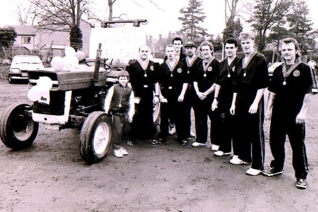 The kung fu team that pushed a tractor for the Sleaford Half Marathon fun run in 1992. Where you among them? EMN-170903-131501001