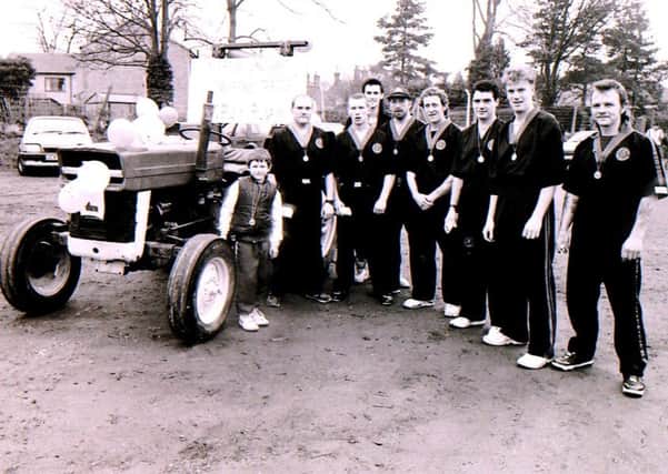 The kung fu team that pushed a tractor for the Sleaford Half Marathon fun run in 1992. Where you among them? EMN-170903-131501001
