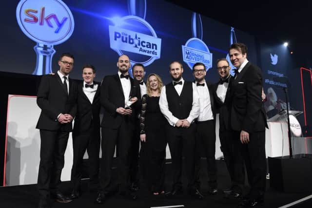 The Coaching Inn Group collect one of their two honours at The Publican Awards 2017 from TV presenter Jonathon Ross.