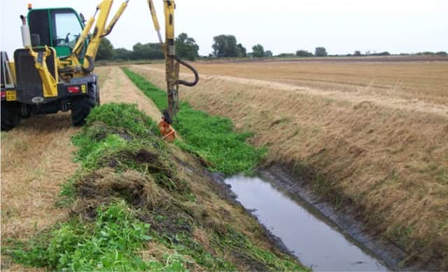 Maintenance of a smaller fen drain to remove weed growth and return the drain to its original design standard.