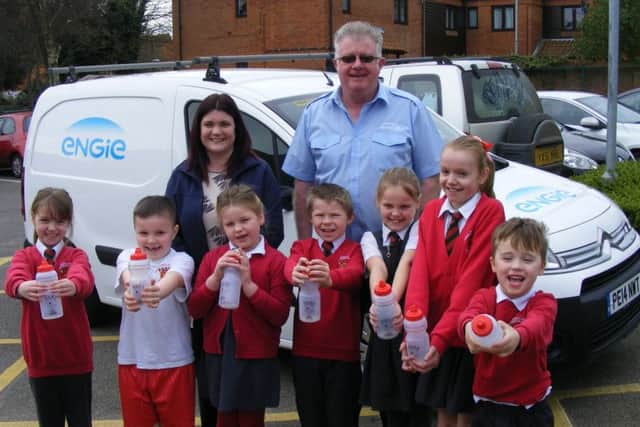 Church Lane Primary Schools thrilled to get their donation of water bottles from Engie's administrator Becky Stocks and services supervisor Steve Brown. EMN-171003-142638001