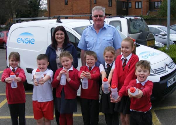 Church Lane Primary Schools thrilled to get their donation of water bottles from Engie's administrator Becky Stocks and services supervisor Steve Brown. EMN-171003-142638001