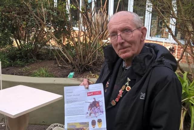 Fred Parker with a poster warning of the threat of the Asian hornet to Lincolnshire Wolds bees.