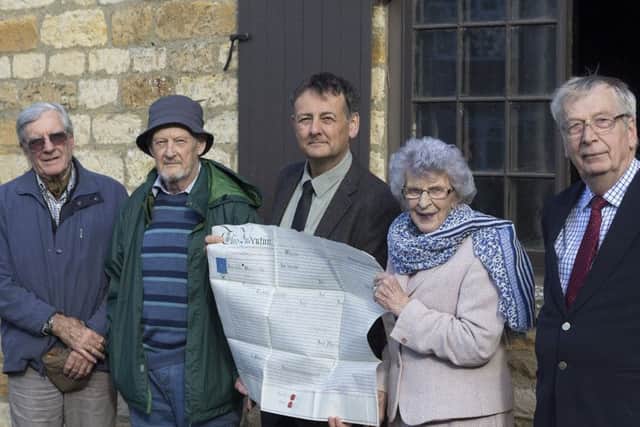 Staunch supporter of heritage in the district, Coun Marion Brighton, with members of Welbourn Parish Council and the deeds for Welbourn Forge. EMN-170313-141838001