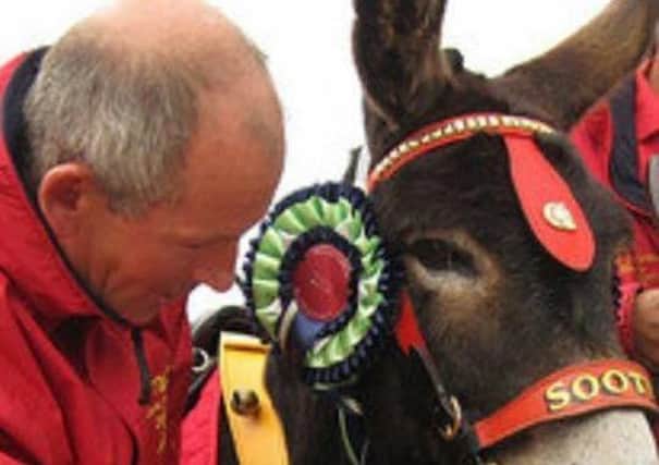John Nuttall with one of his many donkeys will now be doing the donkey rides in Mablethorpe.