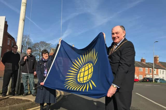 NKDC chairman Coun John Money and vice-chairman Coun Sally Tarry raise the flag for Commonwealth Day. EMN-170313-195504001