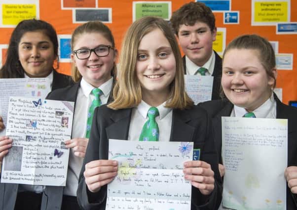 Somercotes Academy French pen pal letters .
Hope Midgley (front) 12, with (l-r) Manisha Bains 13, Freya Donner 13, Harvey Cockerill 13, and Evie Kidd 12- all Year 8.
