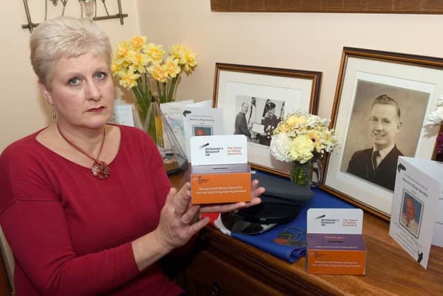 Fiona Hoddy of Quarrington with charity collection boxes from her father's funeral. EMN-170314-113242001