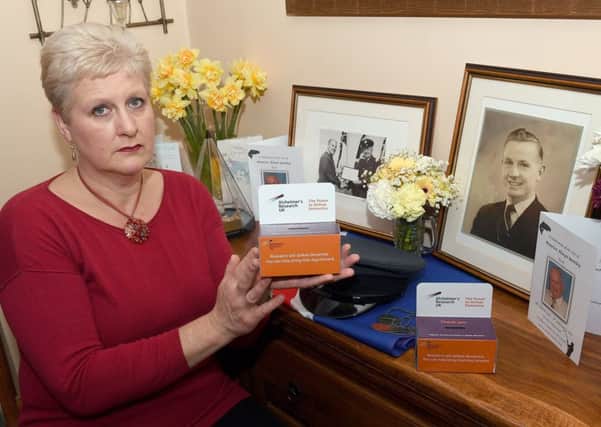 Fiona Hoddy of Quarrington with charity collection boxes from her father's funeral. EMN-170314-113242001