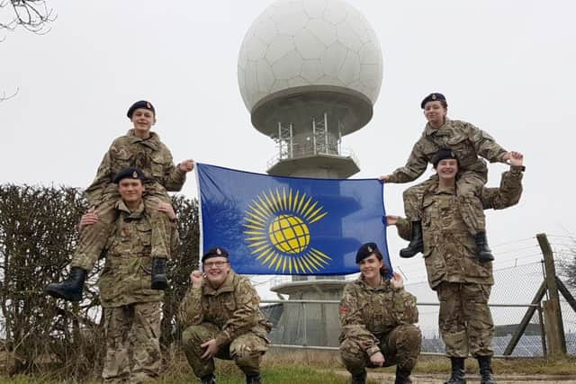 Pictured with the Commonwealth Flag are Corporal Chris Myburgh, Corporal Tom Meads, Lance Corporal Izzy Deans, Lance Corporal Jack Newrick, Cadet Izzy Keyworth and Cadet Elli Mutton EMN-170314-133546001