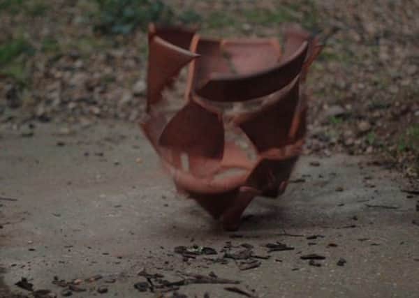 A pot smashing into pieces as it is dropped to the ground. EMN-170320-112848001