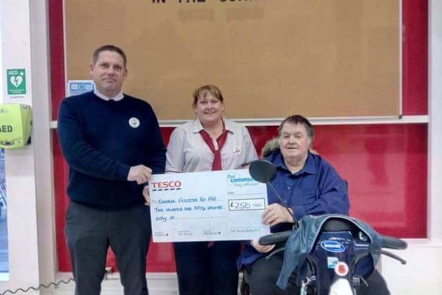 Chris Pettinger, Tesco store manage,r with Jeanette Morley, service manager, and Paul Marshall. ANL-170315-114234001
