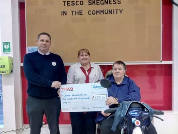 Chris Pettinger, Tesco store manage,r with Jeanette Morley, service manager, and  Paul Marshall. ANL-170315-114234001