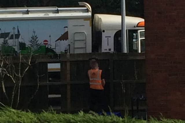 The bin man was caught urinating up a garden fence. Photo: supplied.