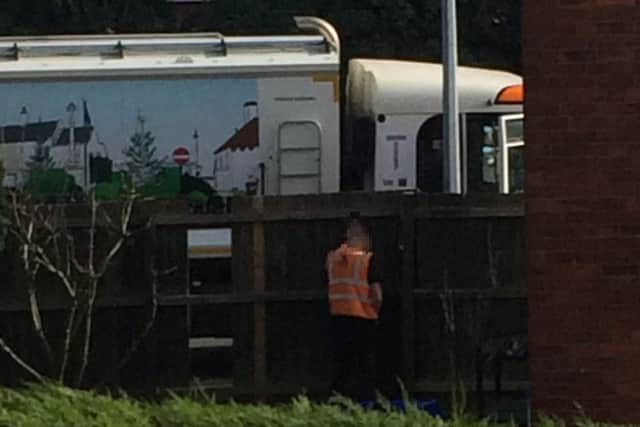 The bin man was caught urinating up a garden fence. Photo: supplied.