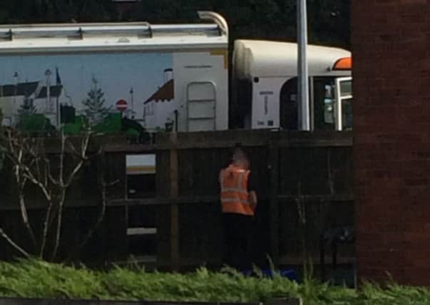 The bin man was caught urinating up a garden fence. Photo: supplied.